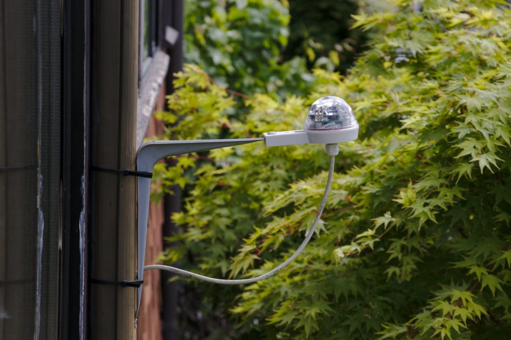  RG-11 rain sensor mounted temporarily on outside of house